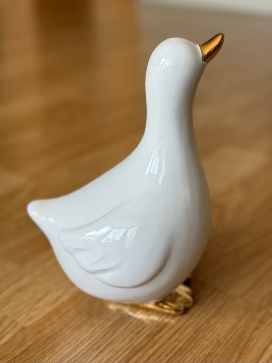 White Ceramic Duck Figurine with Gold Accents image indicator(2)