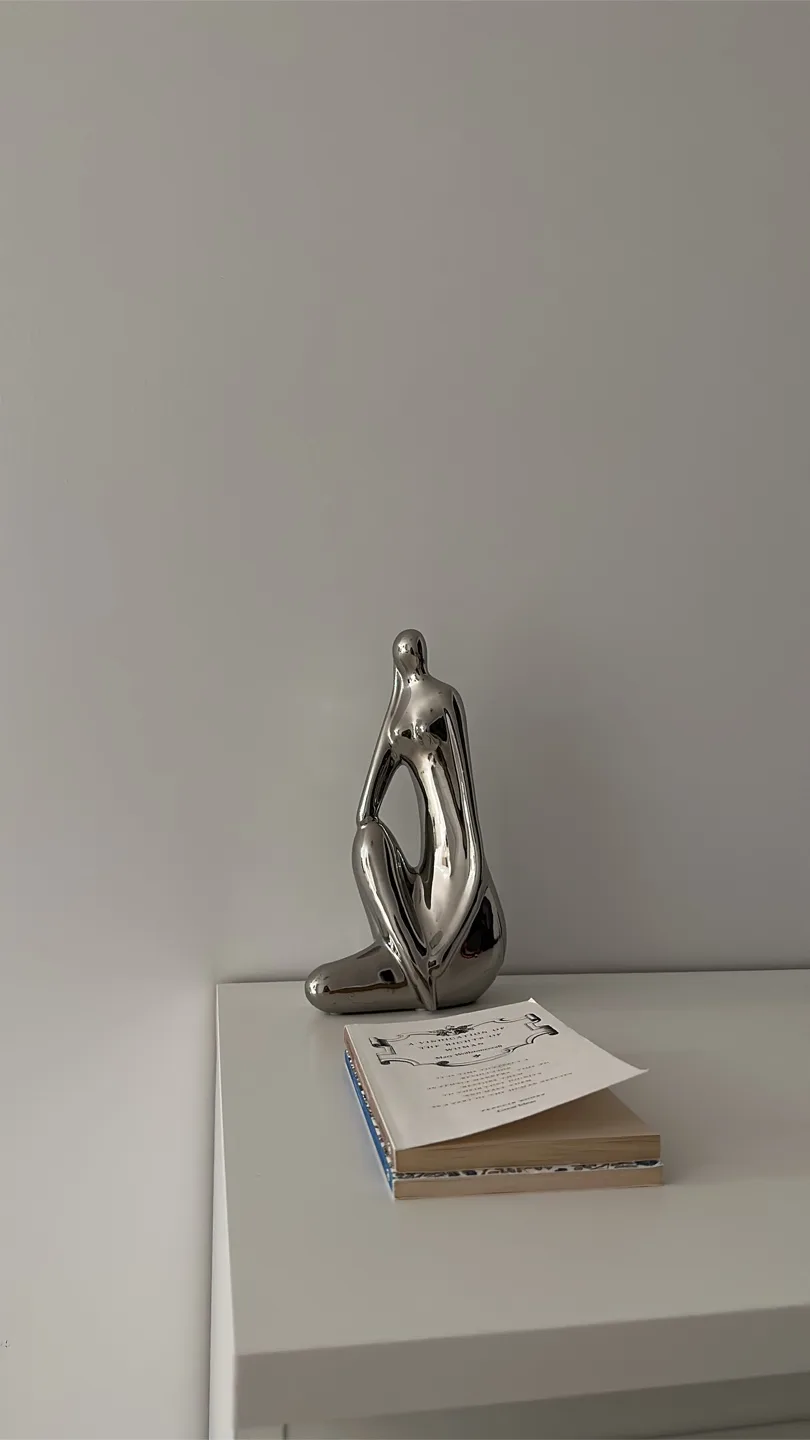 Silver metal Sitting Figure thumbnail