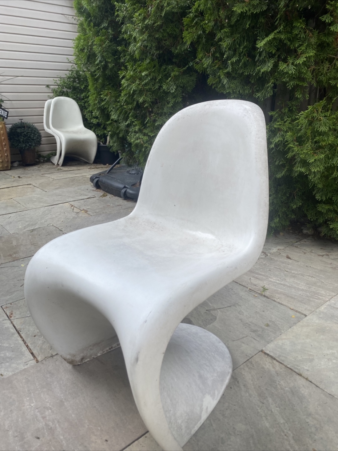 8 white Vitra Panton patio chairs