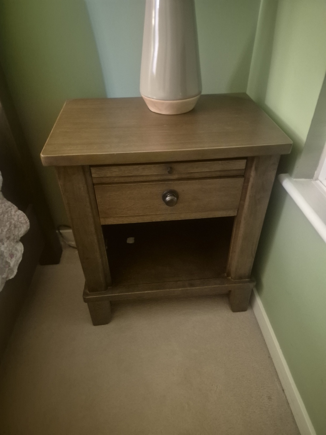 A Wooden Nightstand with Drawer
