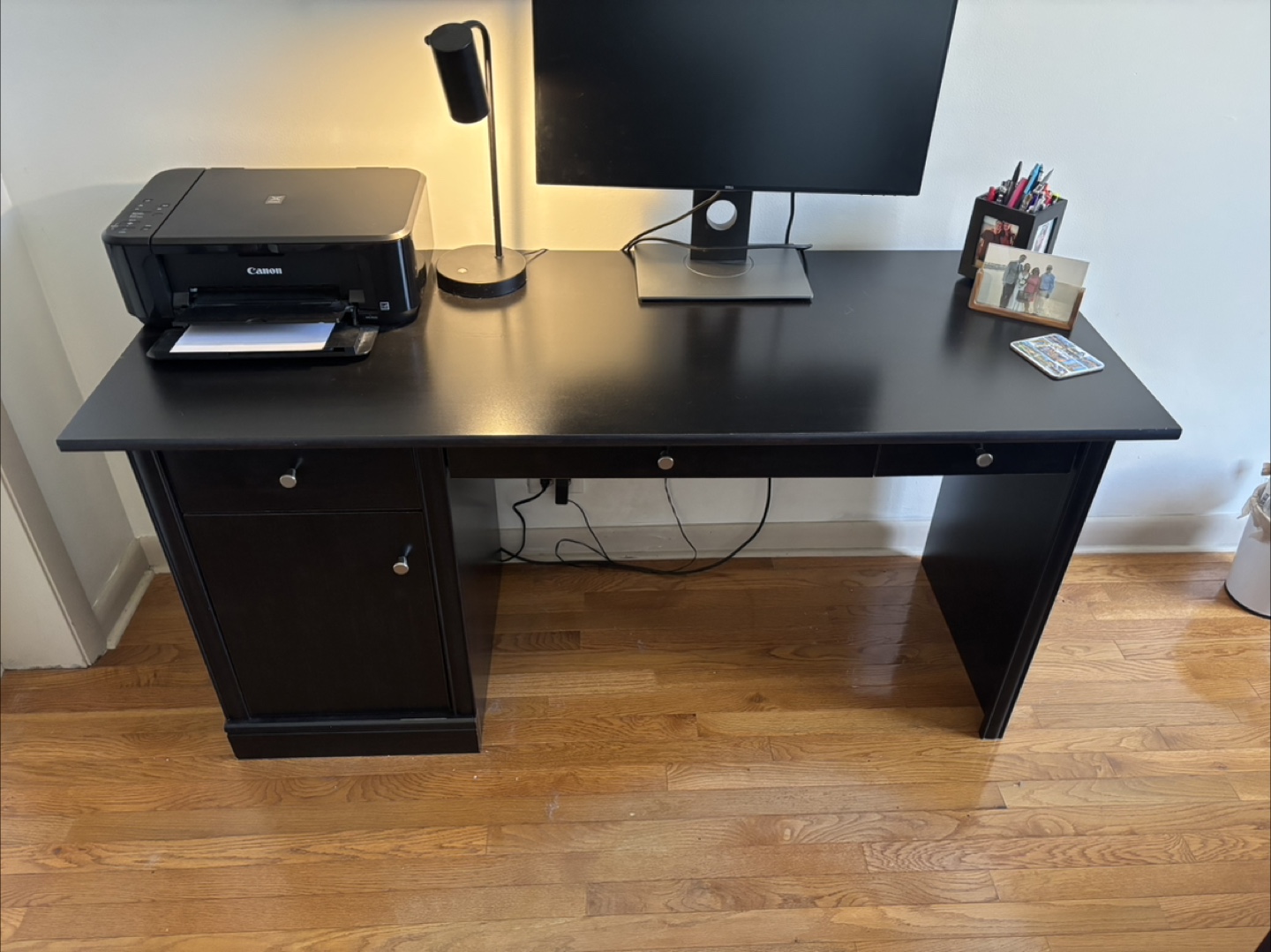 Large black wooden desk