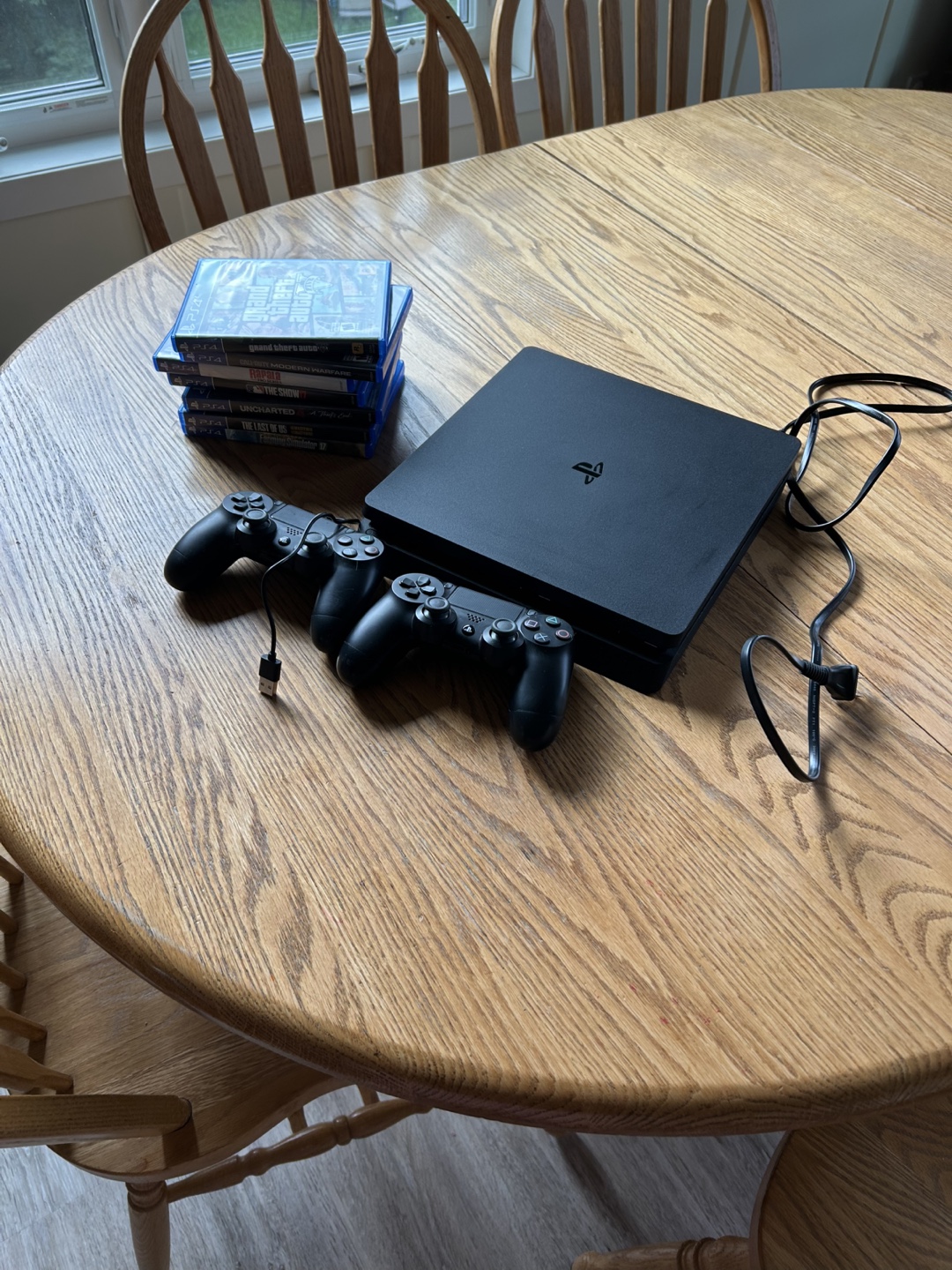 PlayStation 4 with Games and Controllers