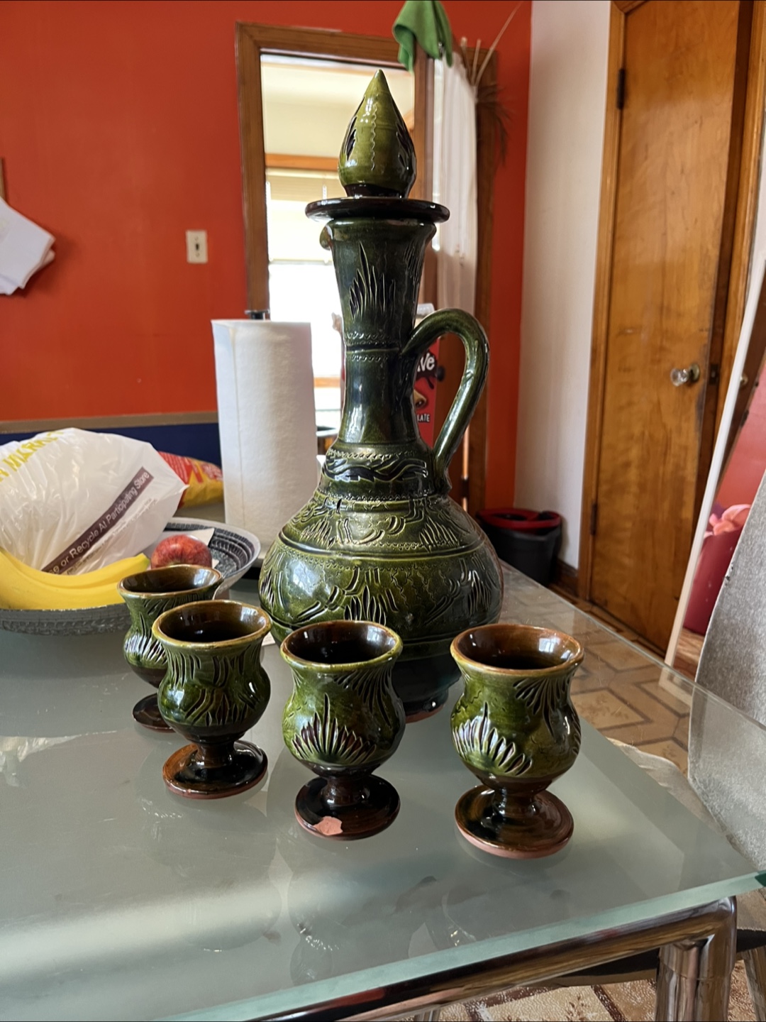 Moroccan clay water pitcher with cups.