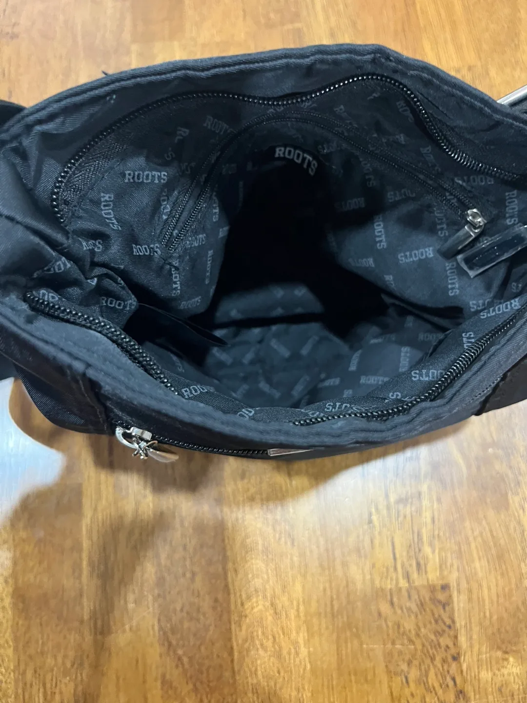 Roots Black Crossbody Bag image indicator(5)