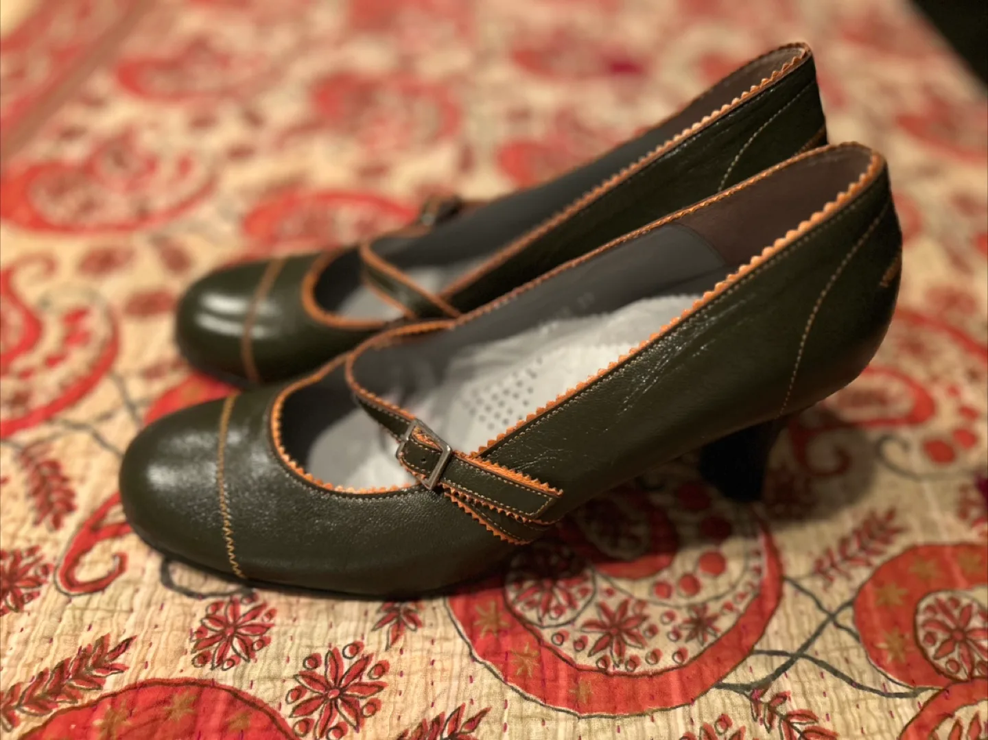 Green heels with slim strap and orange trim image indicator(2)
