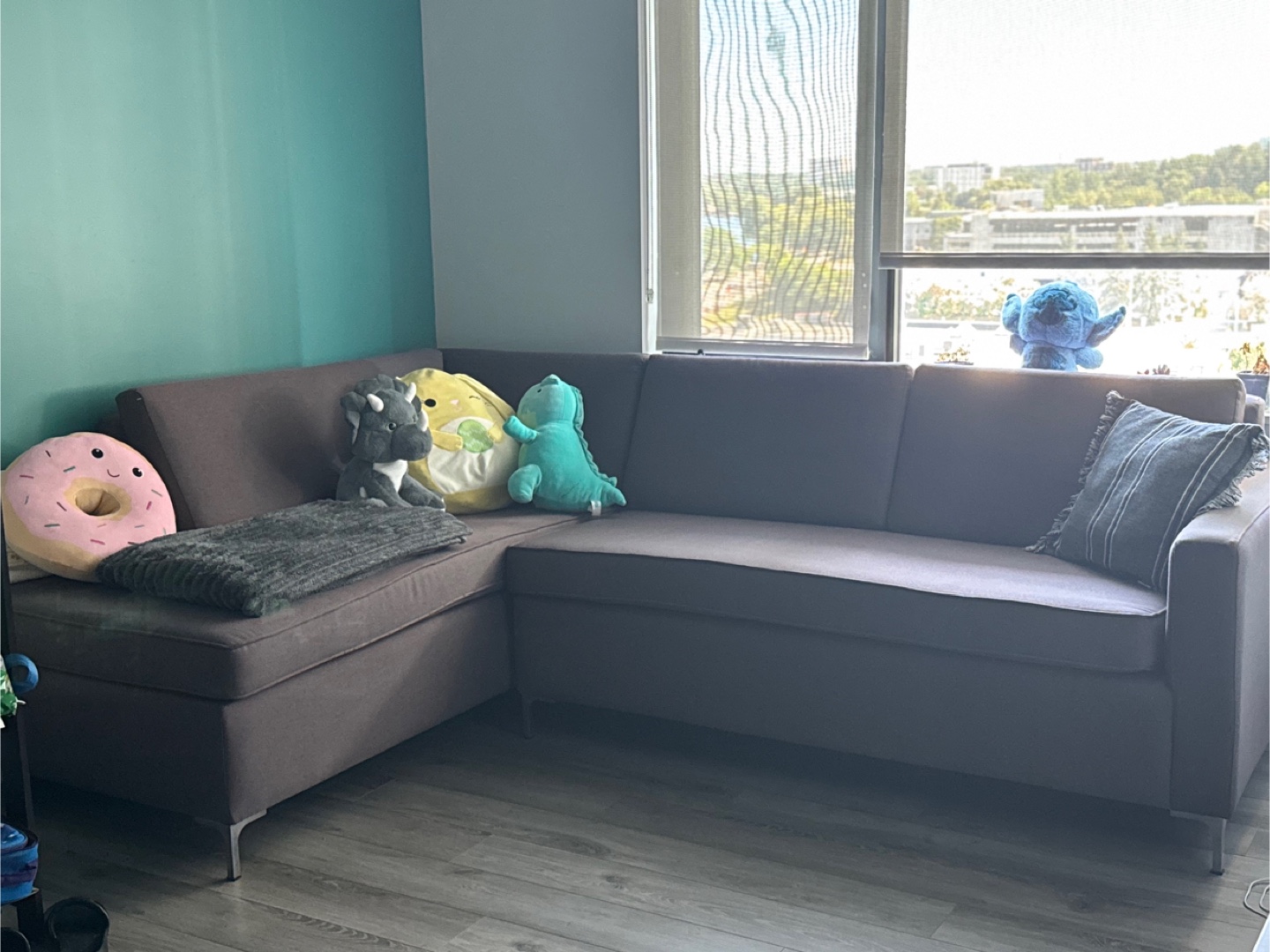 L- shaped dark brown sofa