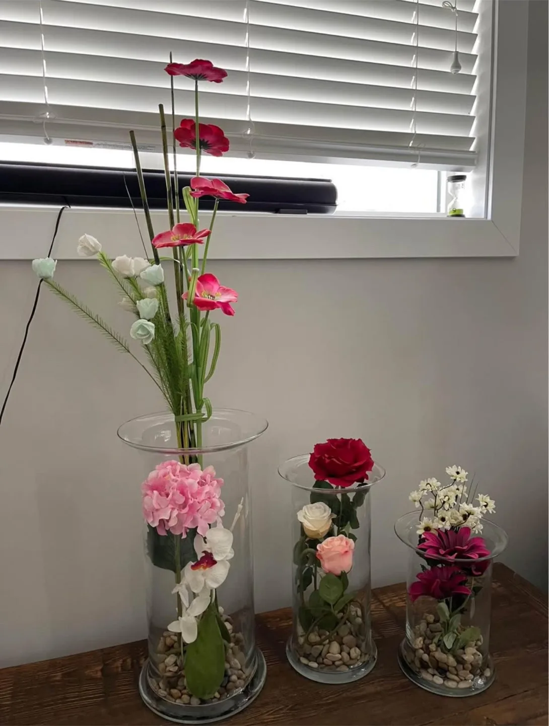 Flower arrangements in glass vases thumbnail