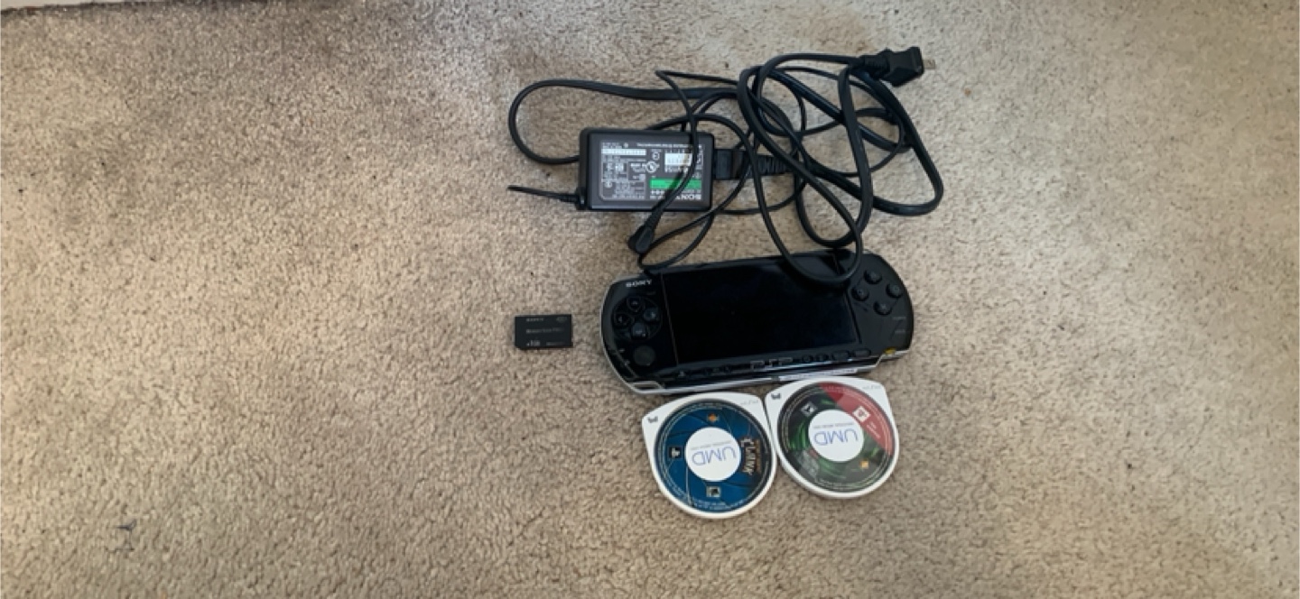 Sony PSP with Charger and Games