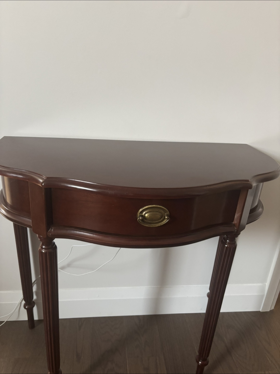 Dark wood side table with drawer