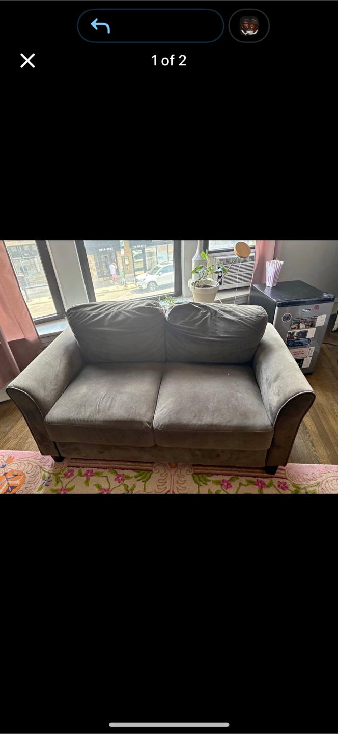 Brown love seat . Small couch