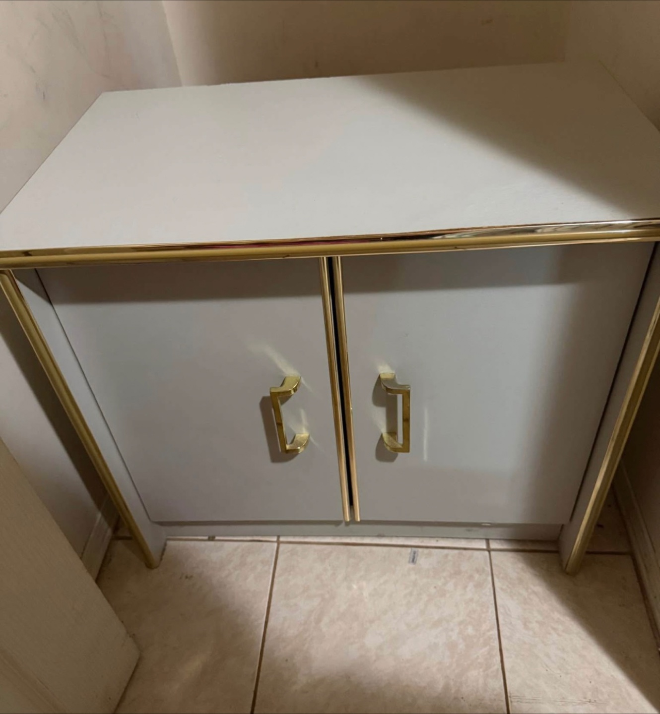 Grey Cabinet with Gold Trim
