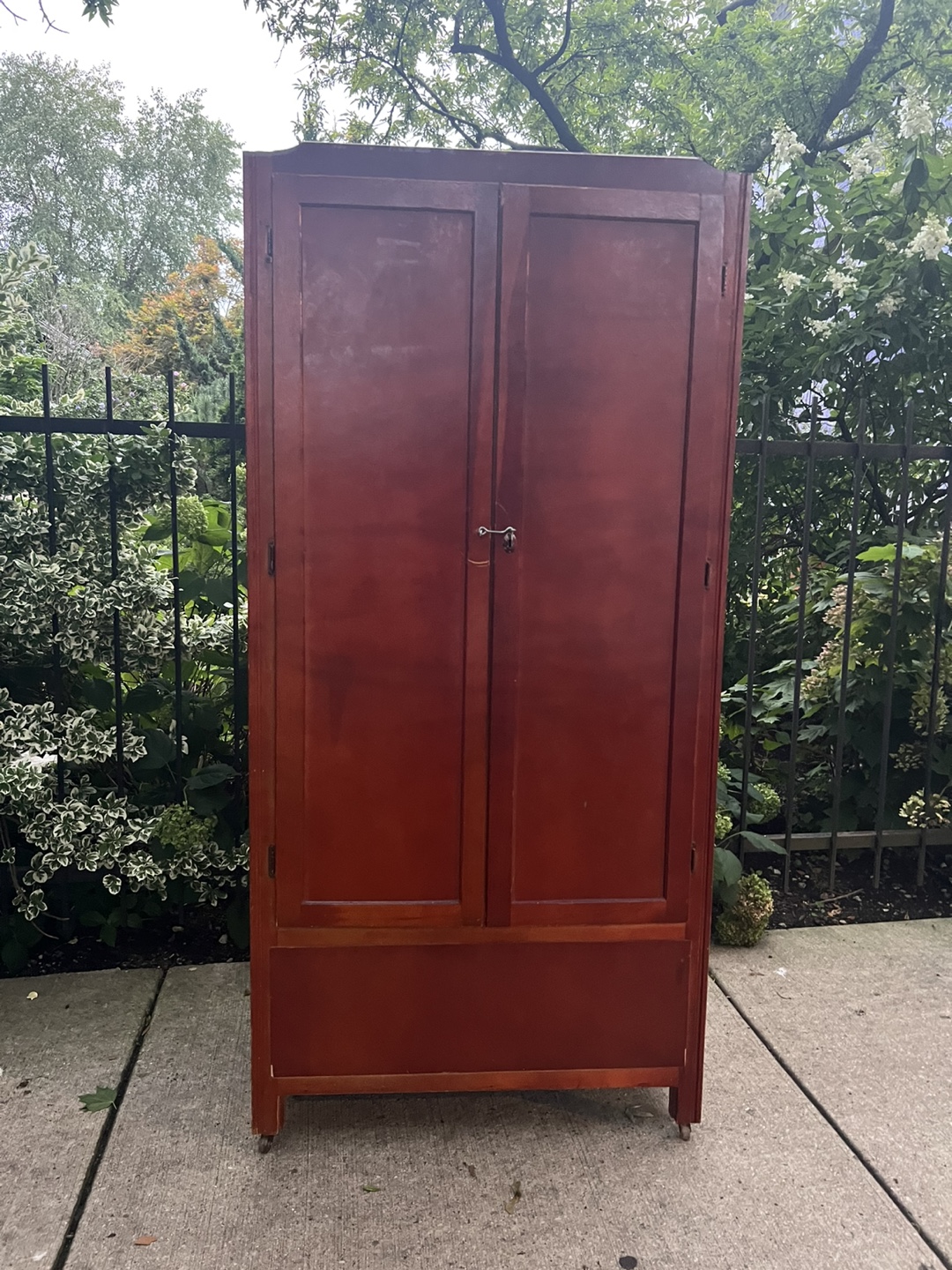 Red Wardrobe, rolls on casters