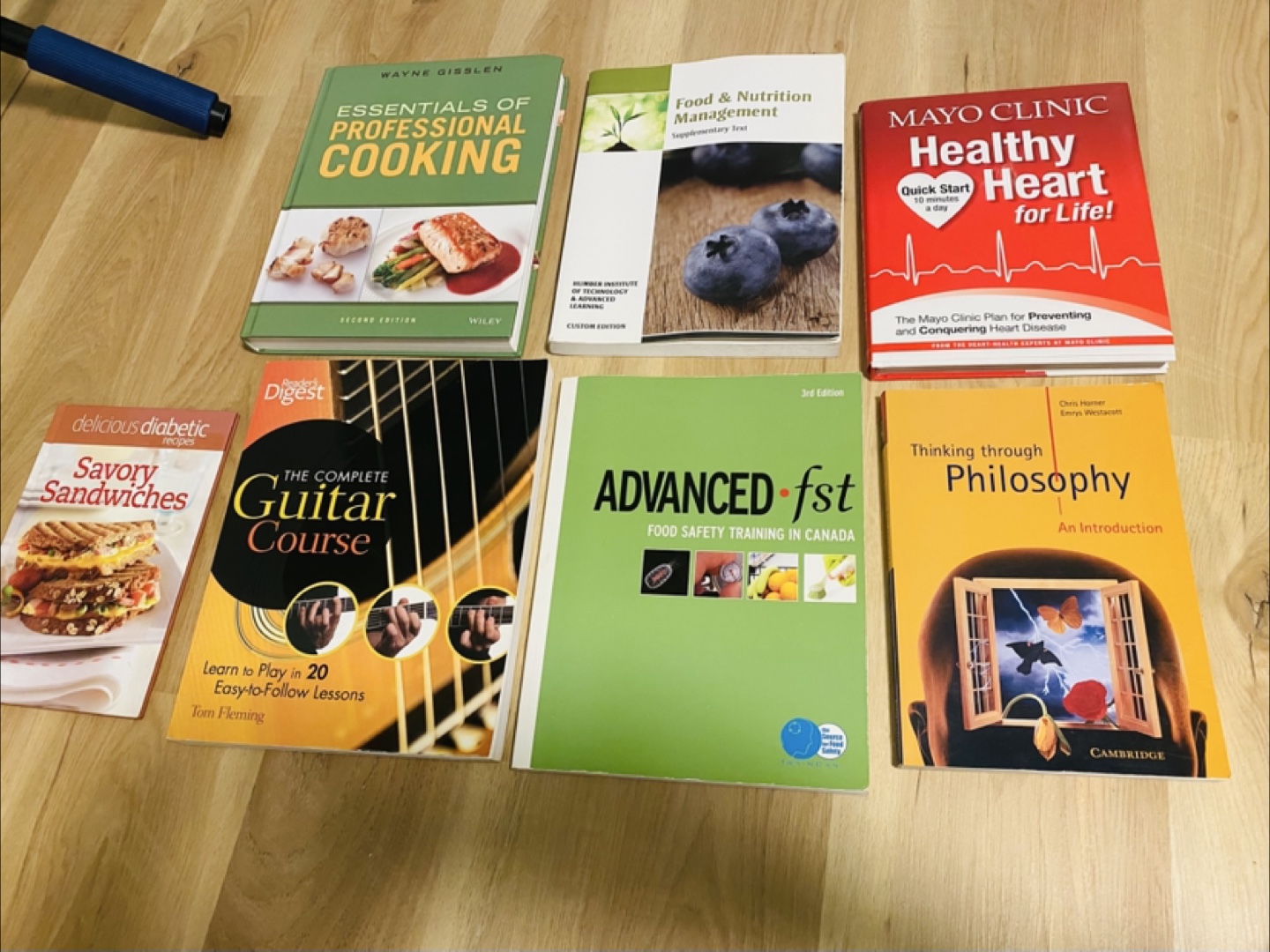 Assorted Cookbooks, Guitar Course, Philosophy Book