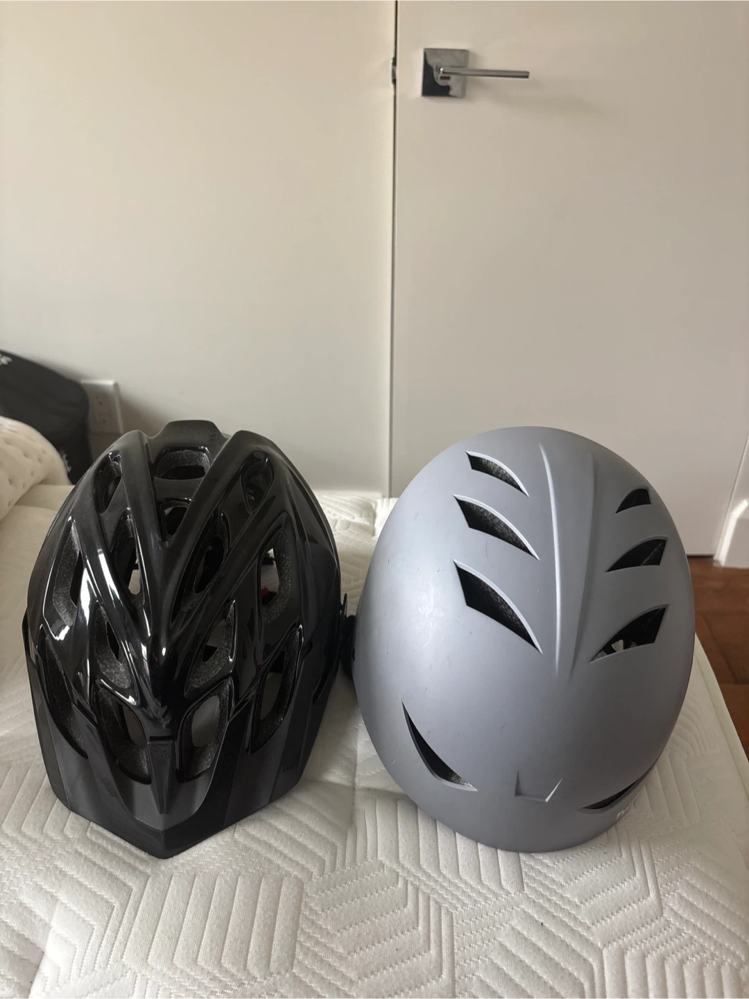 Two Bike Helmets - Black and Gray