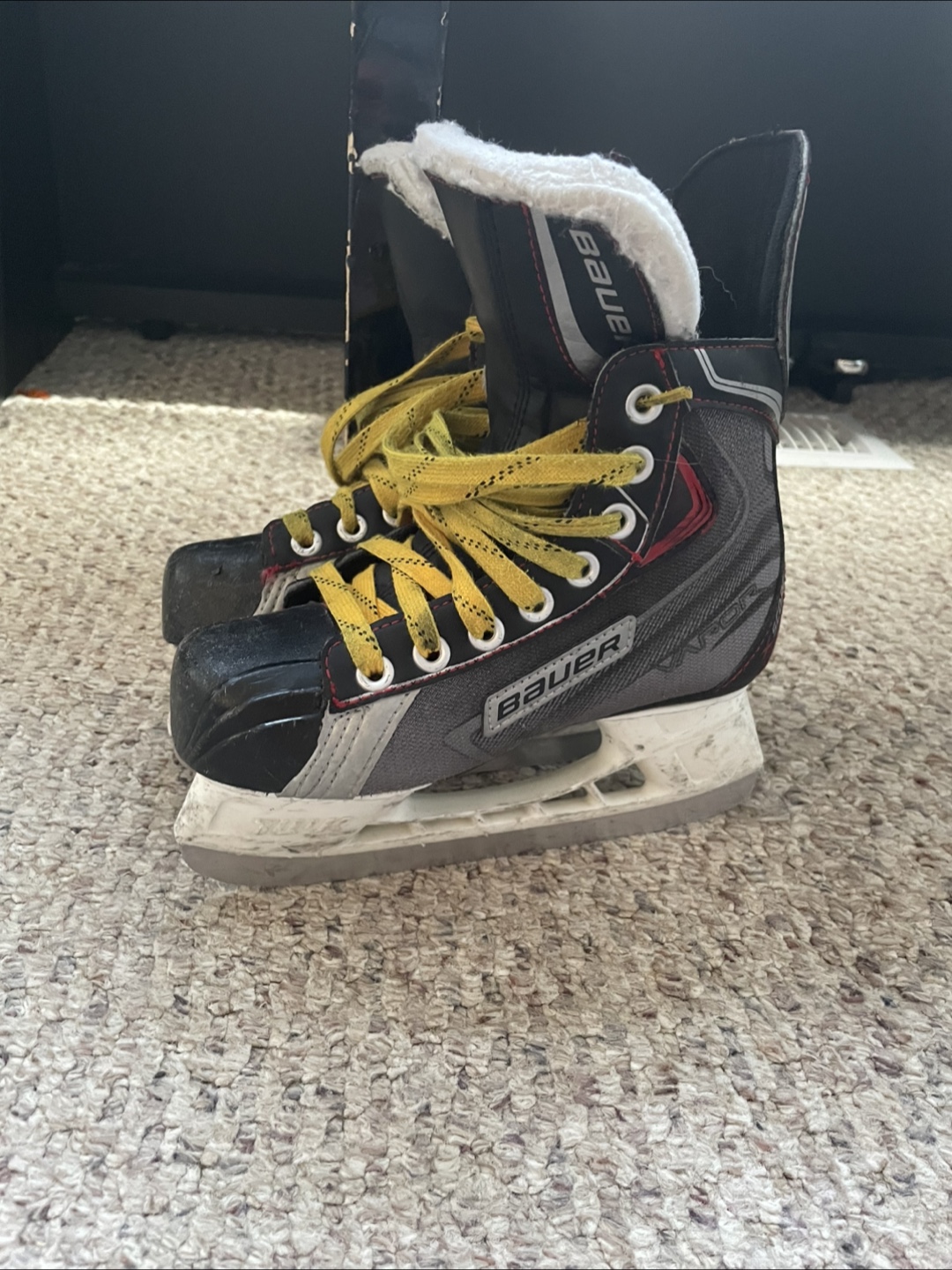Three pairs of youth hockey skates