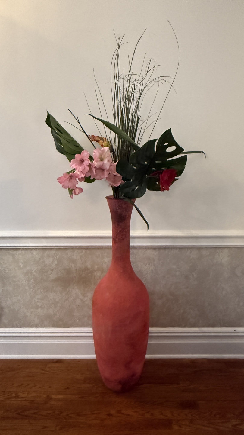 Large pink vase with faux flowers