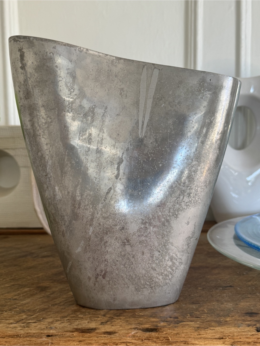 Asymmetrical aluminum vase .