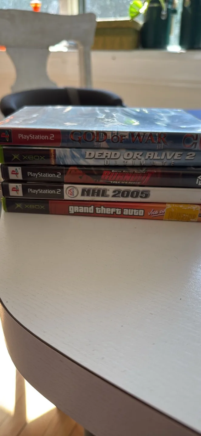 Video Games: God of War, Dead or Alive 2, NHL 2005 thumbnail