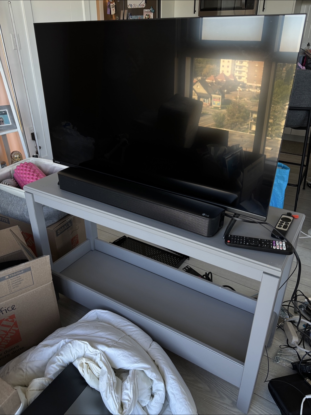 Skyworth 40” TV + LG Soundbar + TV Stand