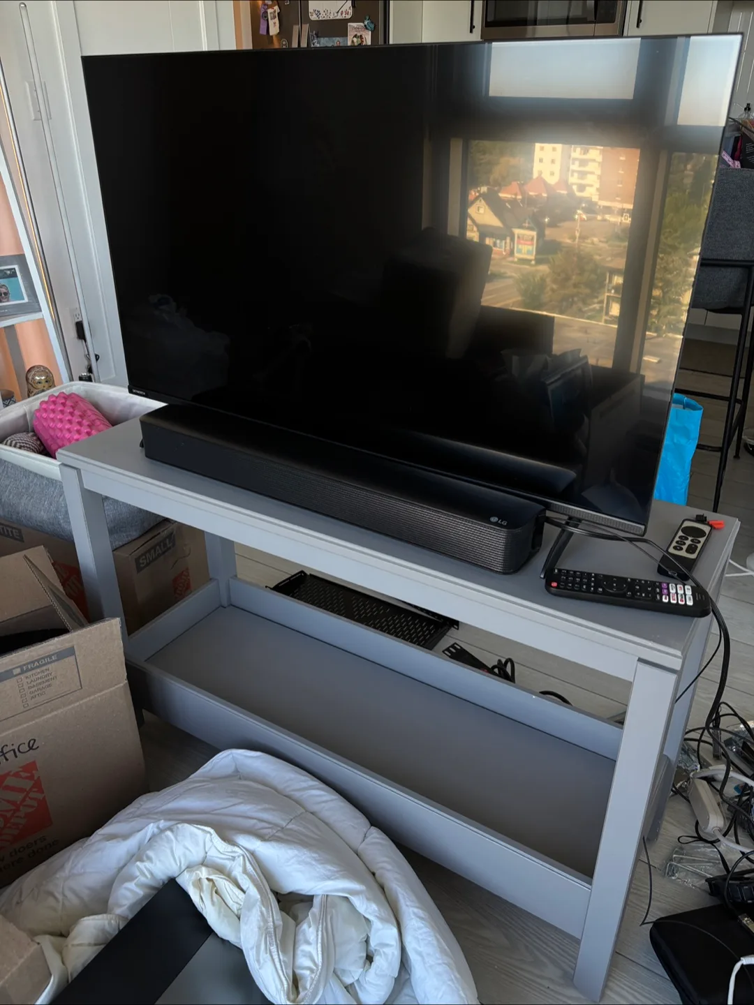 Skyworth 40” TV + LG Soundbar + TV Stand