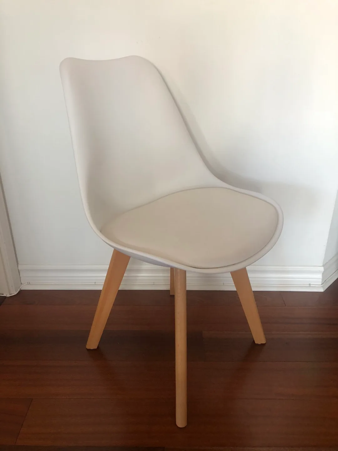 White plastic chair with padded seat thumbnail