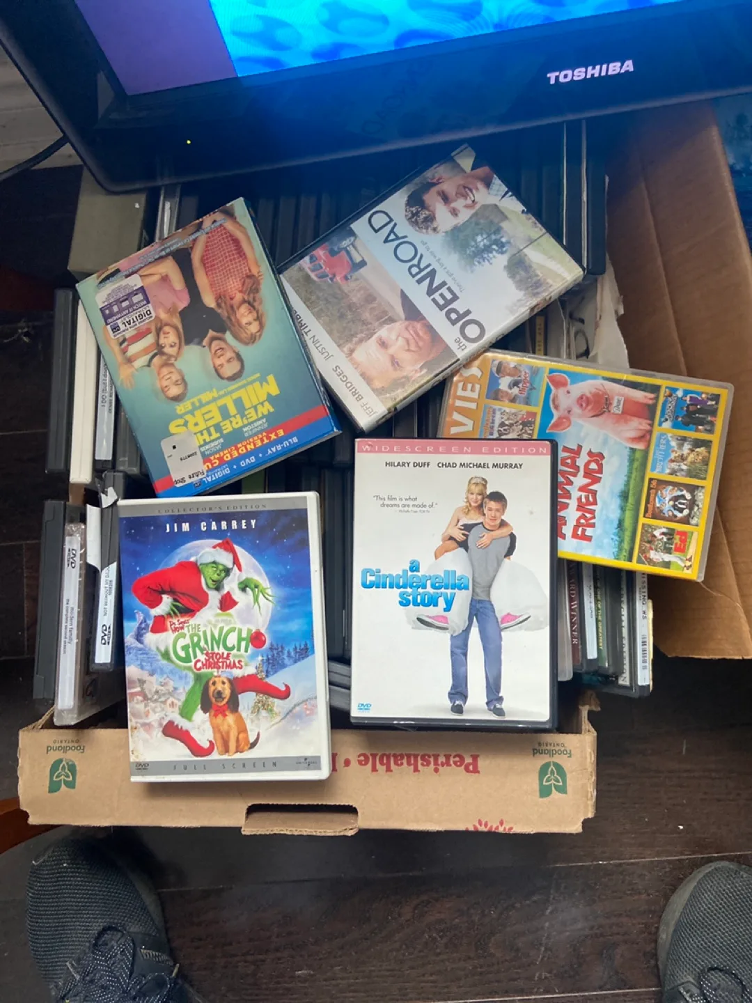 Tv with dvd player inserted and DVD  collection image indicator(5)