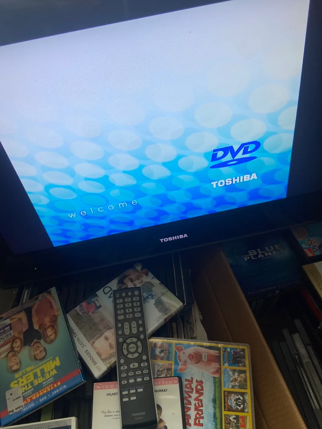 Tv with dvd player inserted and DVD  collection image indicator(2)