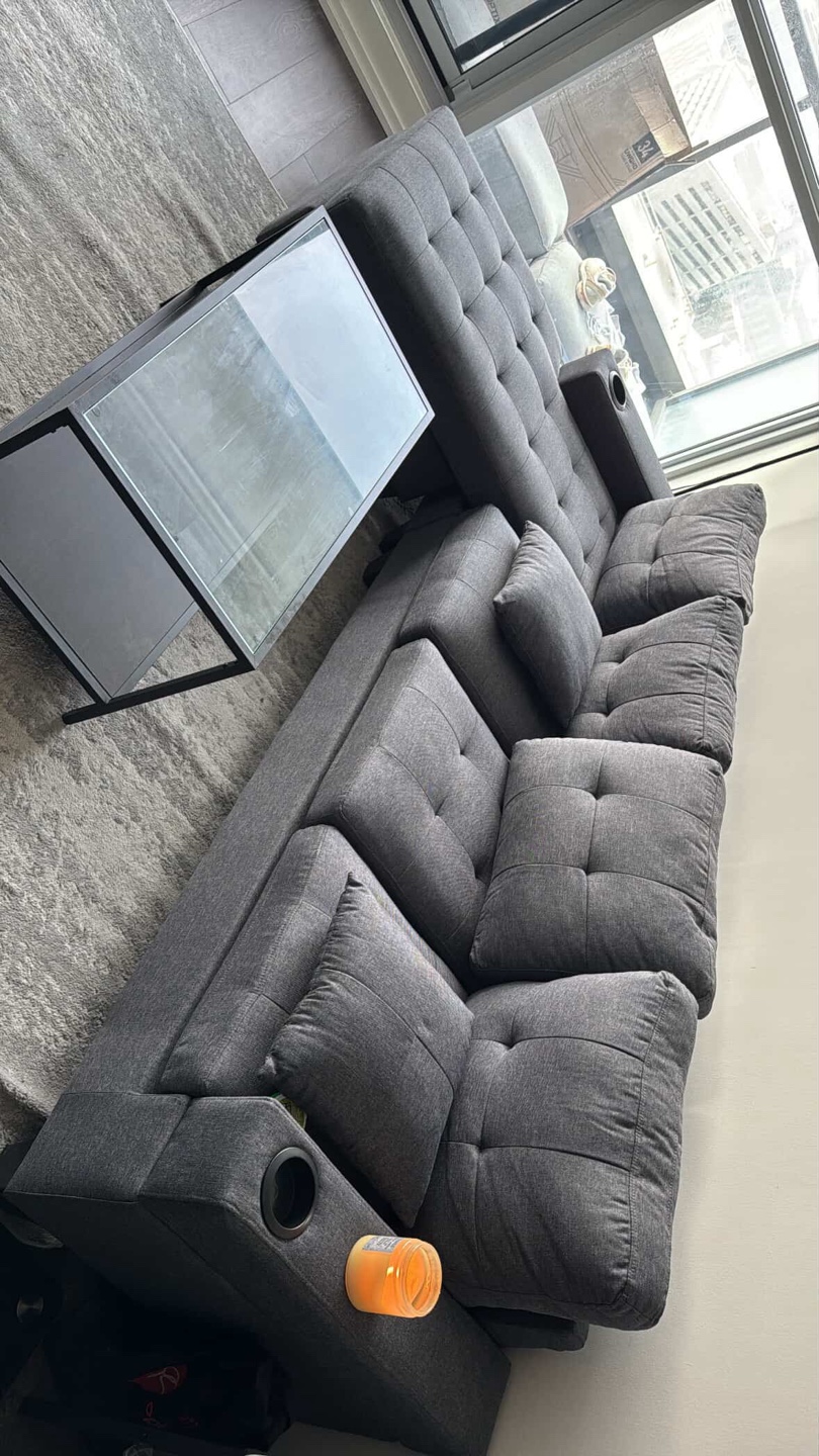 L shaped couch with cushions and cup holder