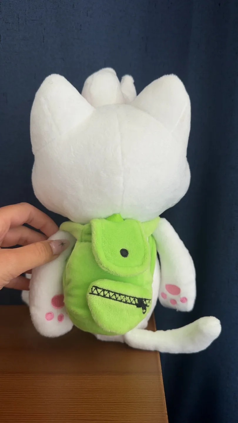 White Cat Plushie with Green Backpack image indicator(2)