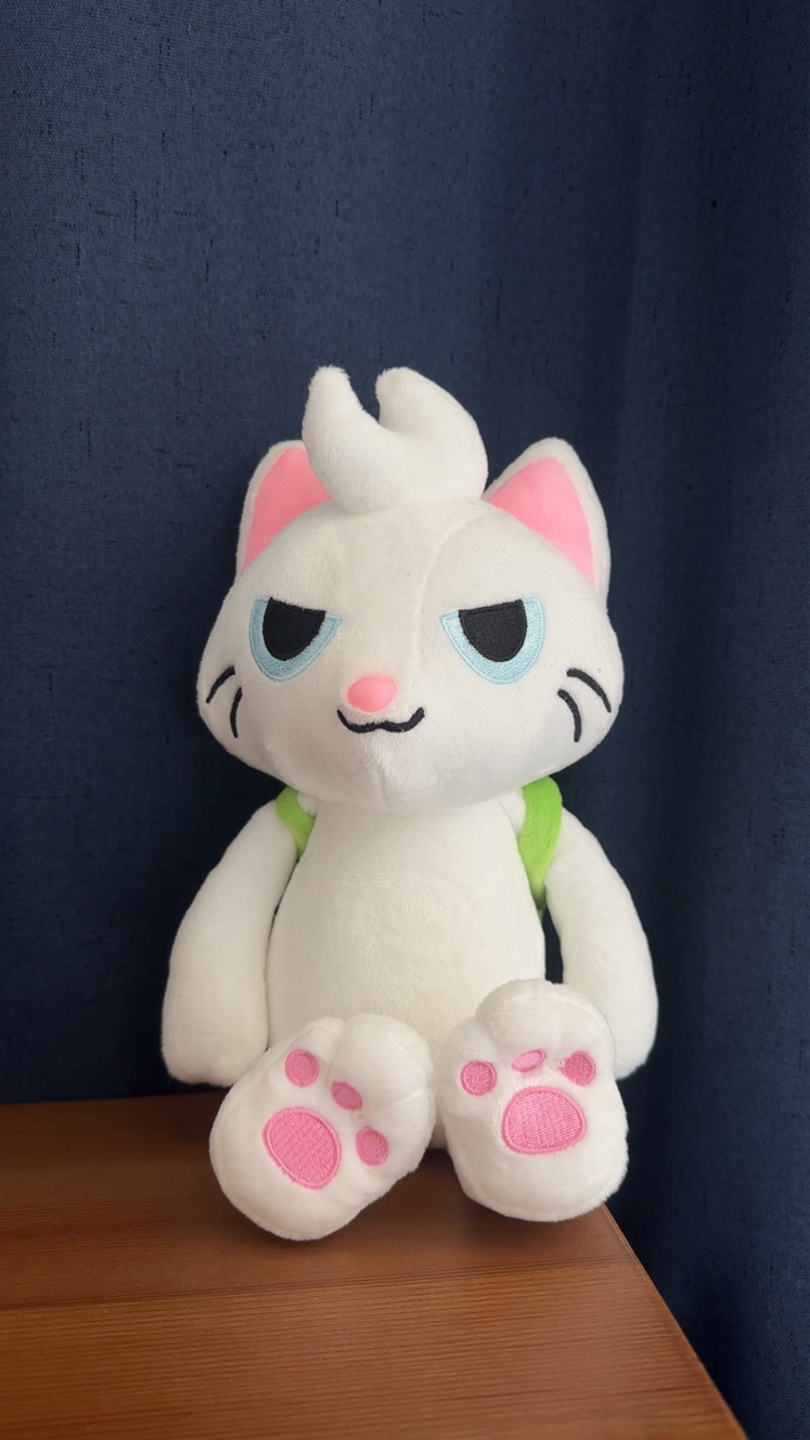 White Cat Plushie with Green Backpack
