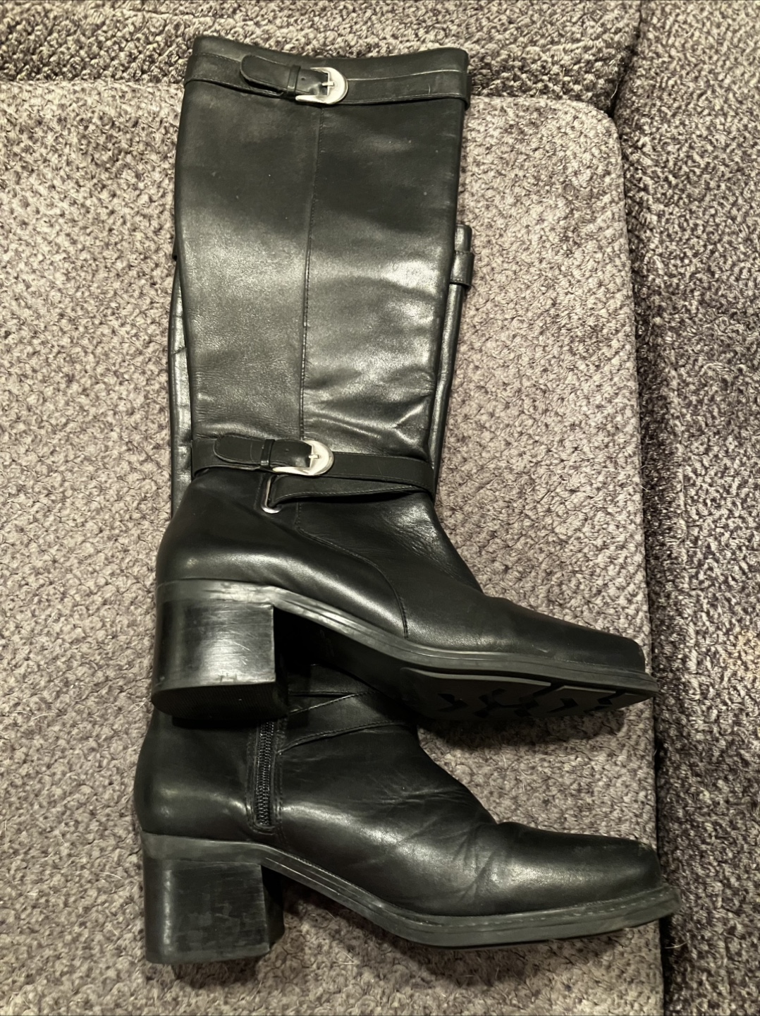Women’s black leather boots.