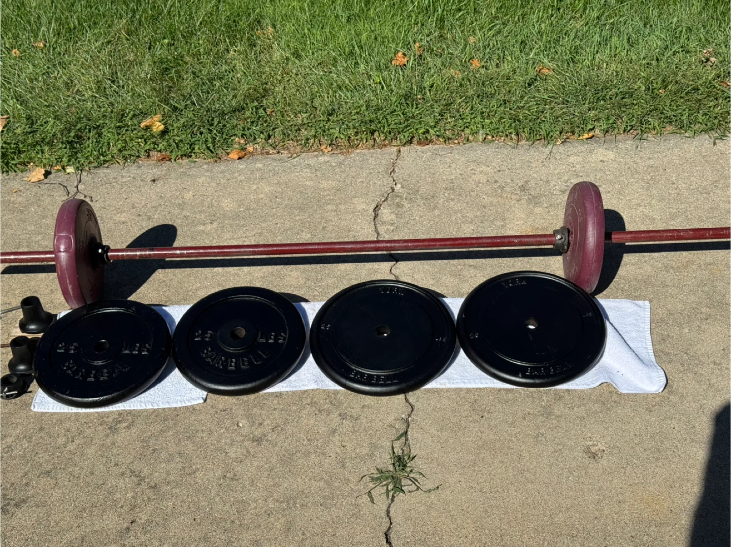 Weigh set total 128 + lbs 4-25 pound & 2- 14.3 lbs bar and 5