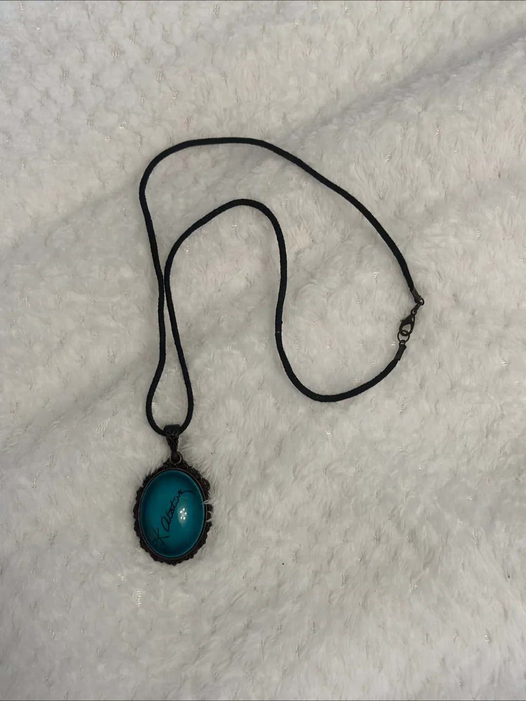 handmade necklace with a turquoise pendant. signed K. Ataturk thumbnail