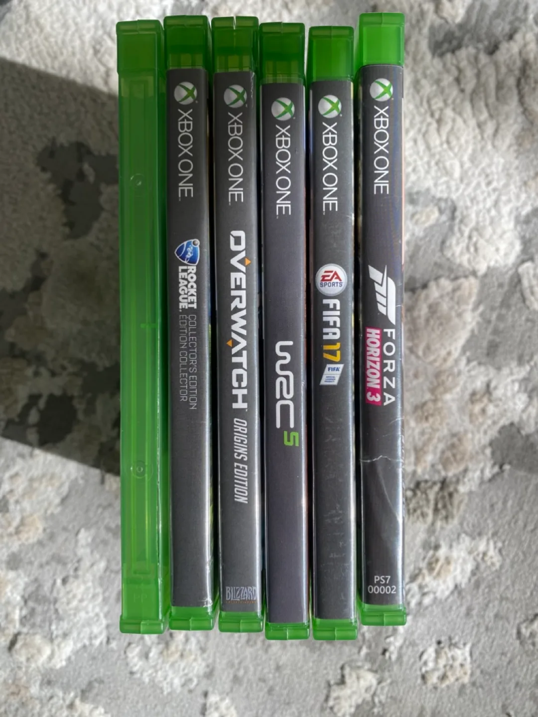 Xbox One S, 5 controllers, headset, and games image indicator(5)