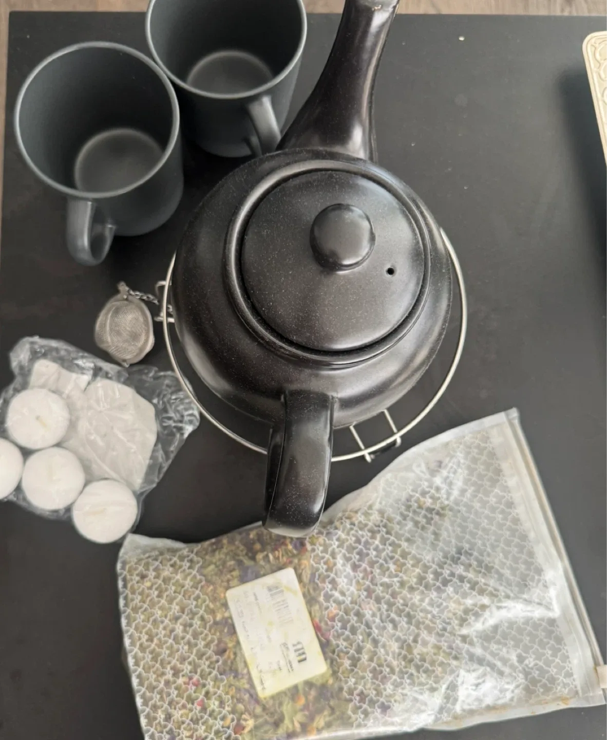 Tea set with teapot, warmer, infuser, and flower tea thumbnail