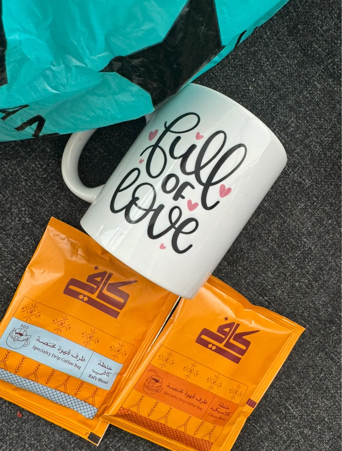 Black drip Specialty Coffee Bags made in saudi with a mug thumbnail
