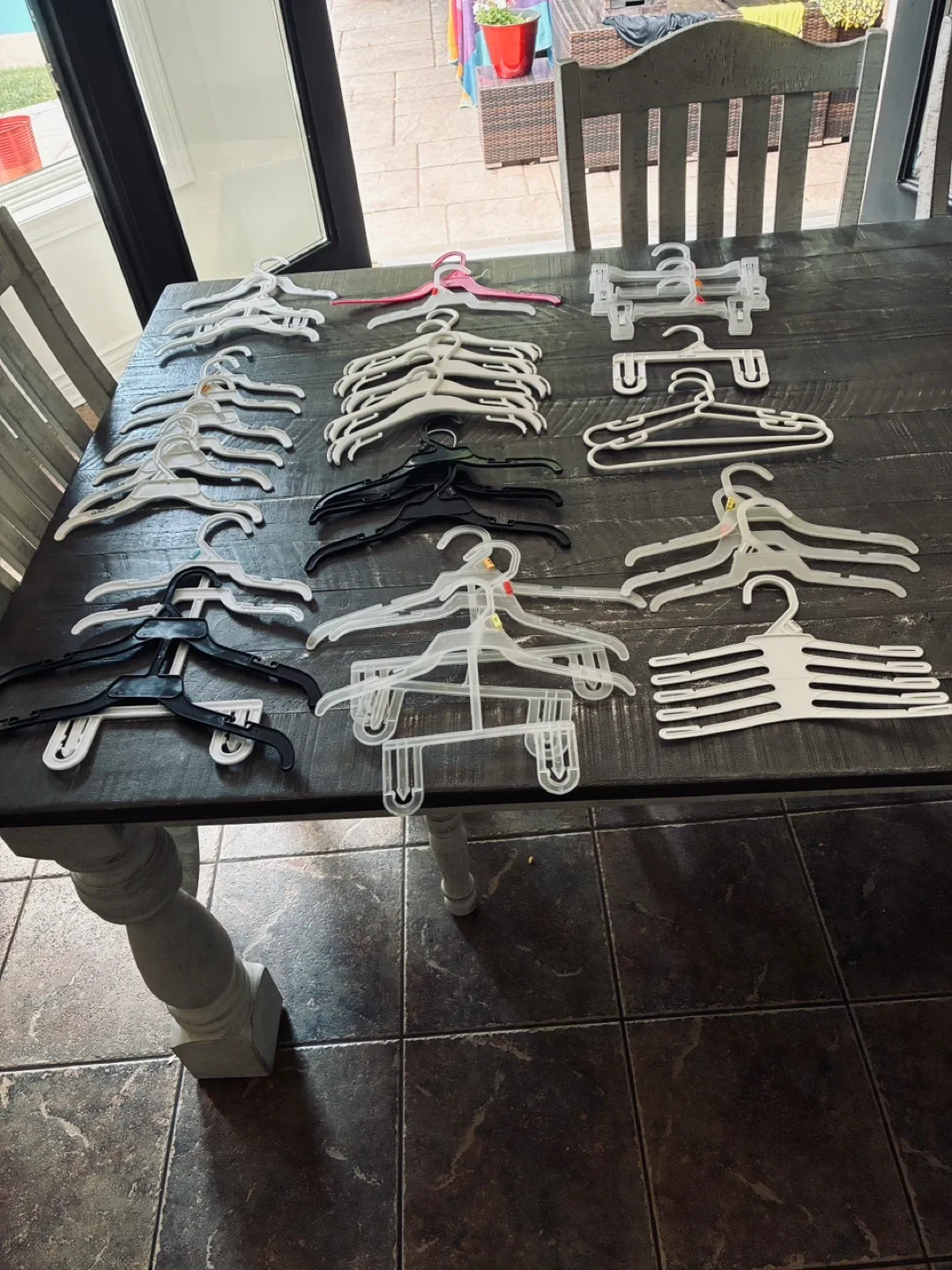Large assortment of plastic baby hangers thumbnail