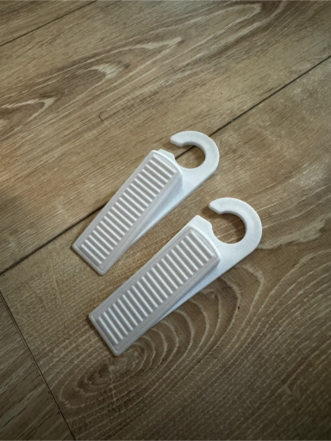 2 White Plastic Door Stoppers thumbnail