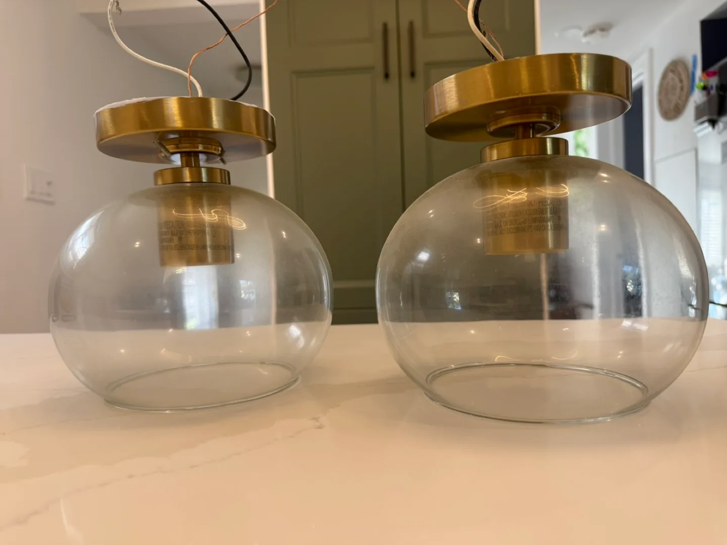 Two pendant lights with glass globe image indicator(2)