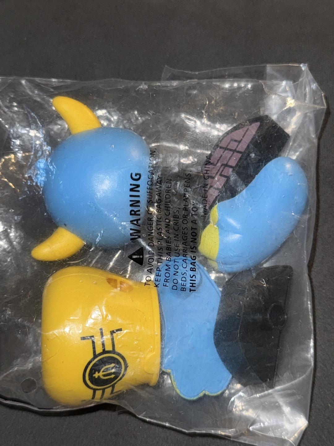 Toy Parts in Bag - Yellow, Blue, Black