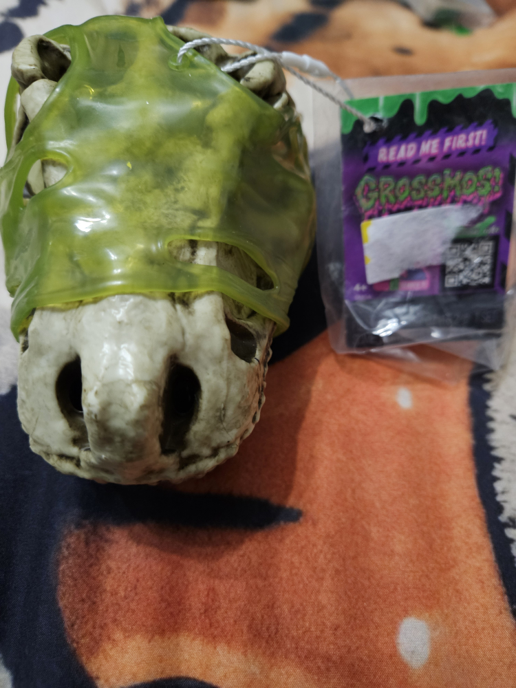 Gross Ghost Dinosaur Head Toy