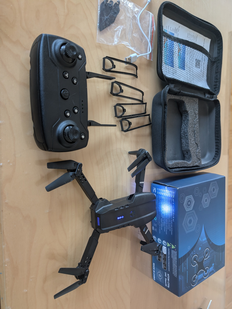 Black foldable drone with remote control