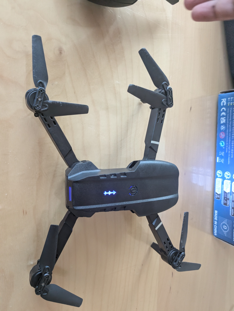 Black foldable drone with remote control - photo 3