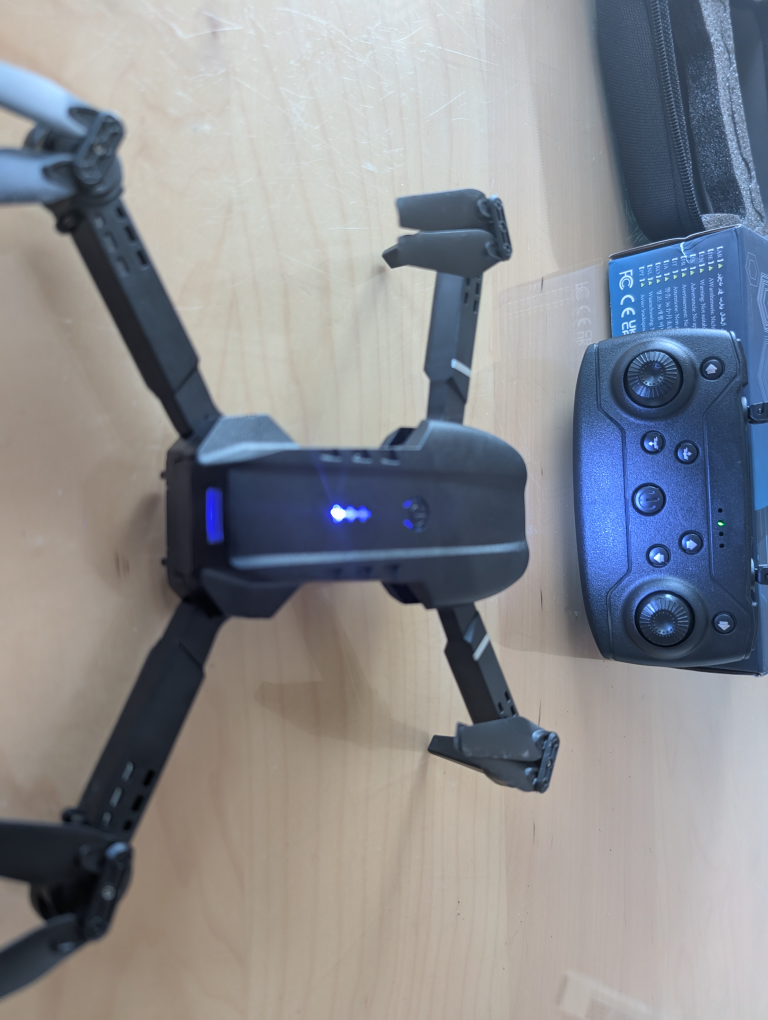 Black foldable drone with remote control - photo 5