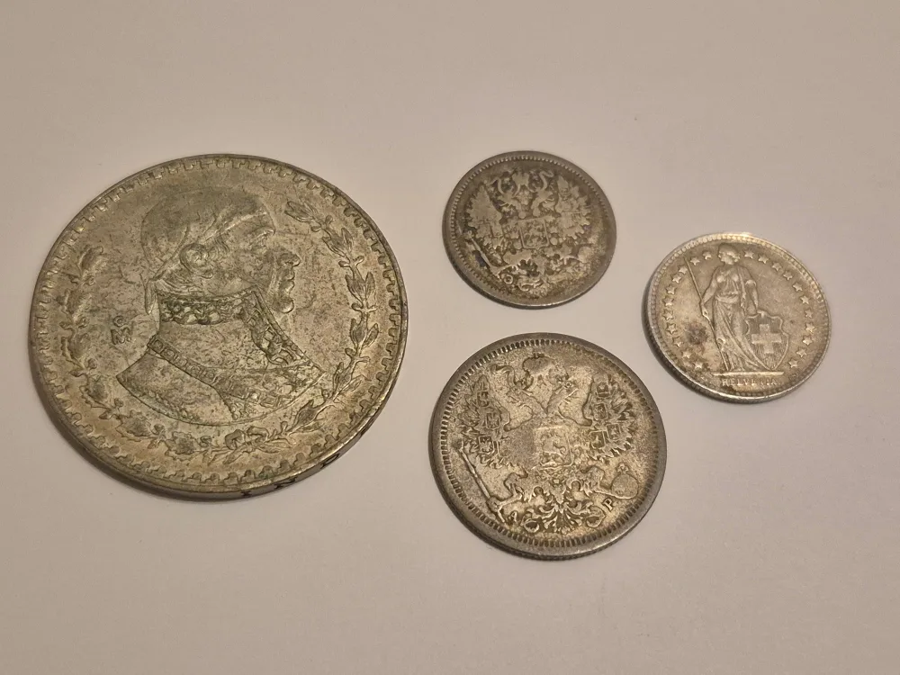 Four silver foreign coins thumbnail