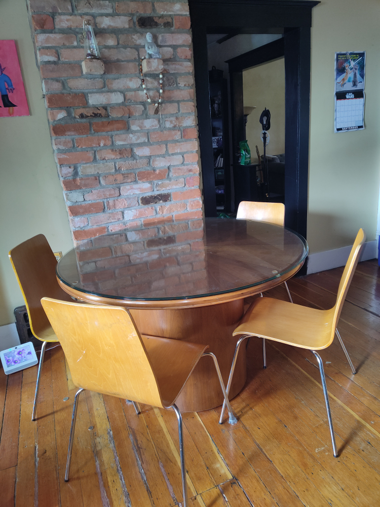 Round dining room table with glass top
