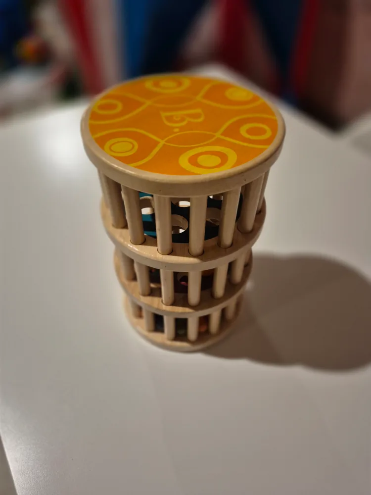 B. Toys Wooden Rattle-Me-Roll Toy image indicator(2)