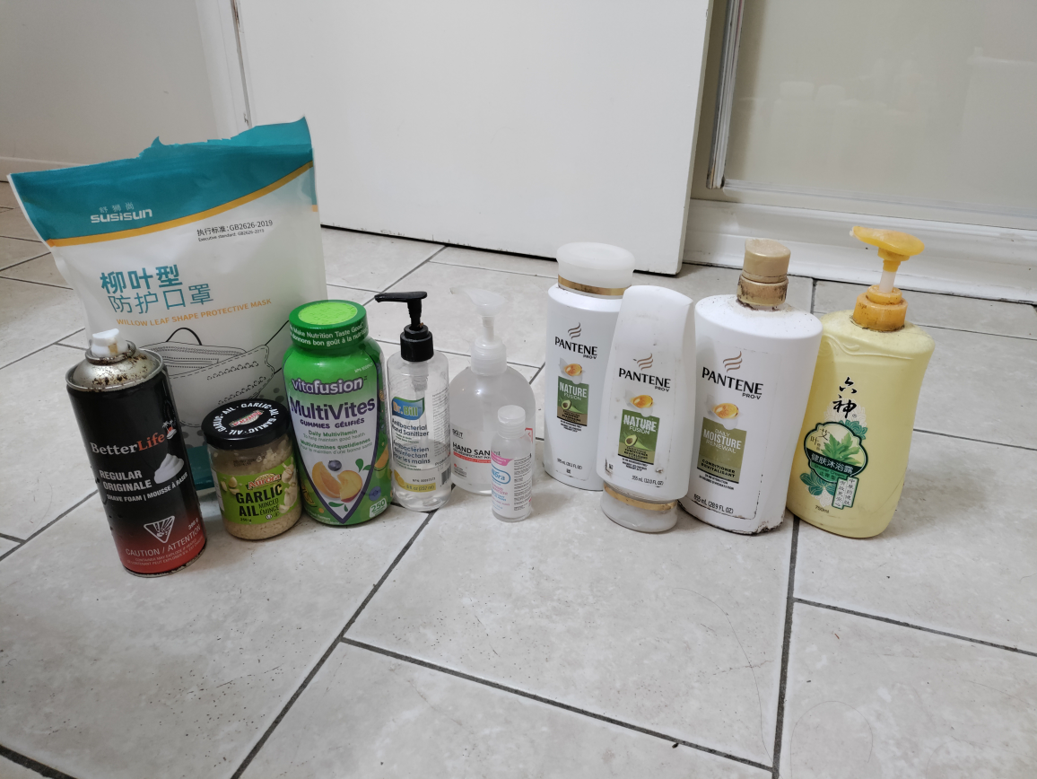 A bunch of shampoos hand sanitizer and vitamins