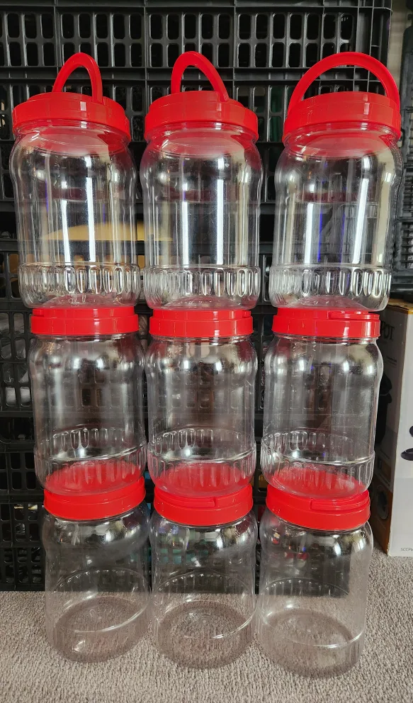 Plastic Storage Jars with Red Lids thumbnail