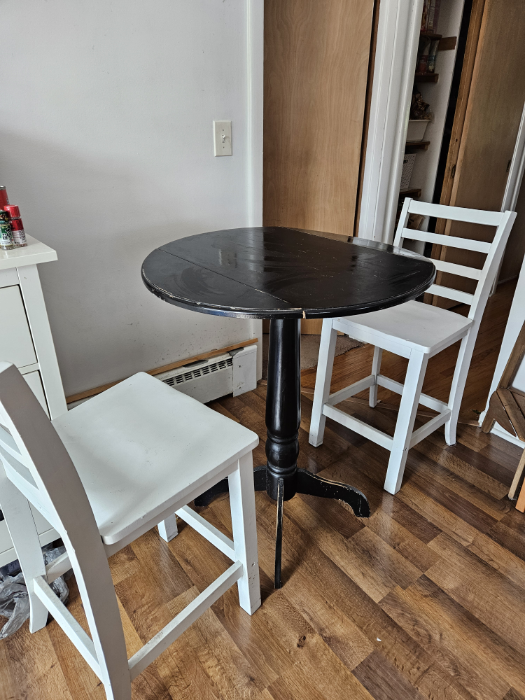 Small Round Table with Two White Chairs